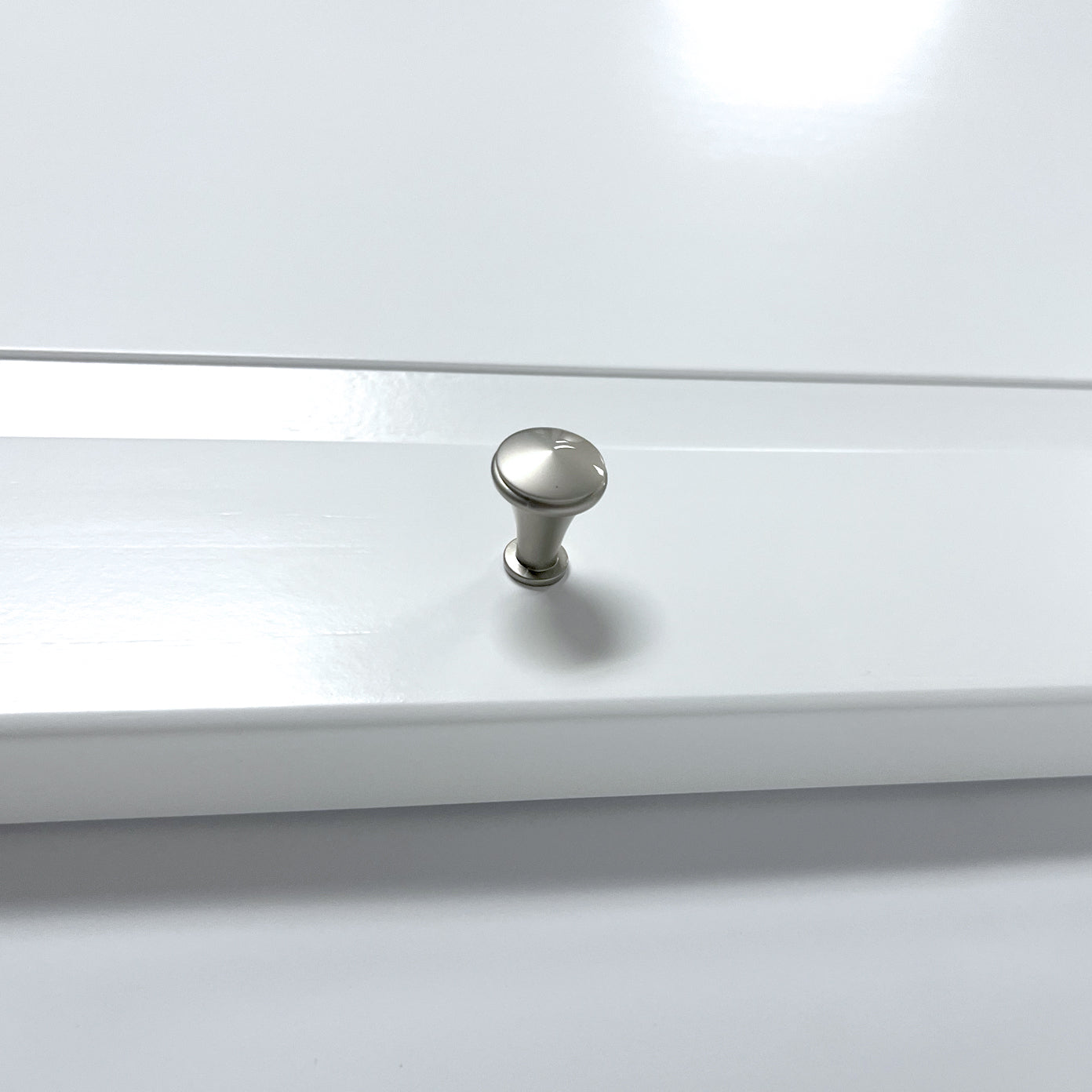 close up of door handle on white tower door