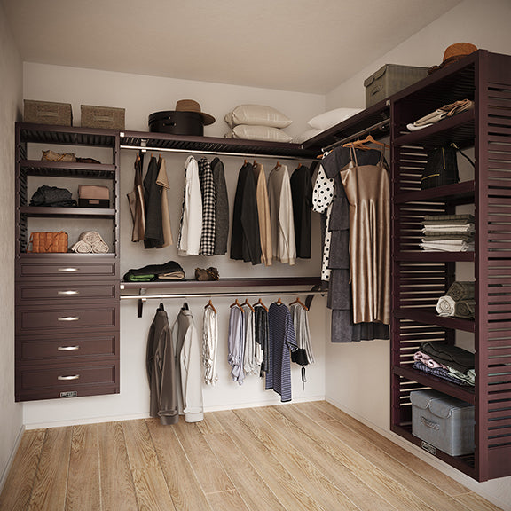 Espresso L Shaped walk in closet organizer with 5 drawers,  clothes and hanging in a room.