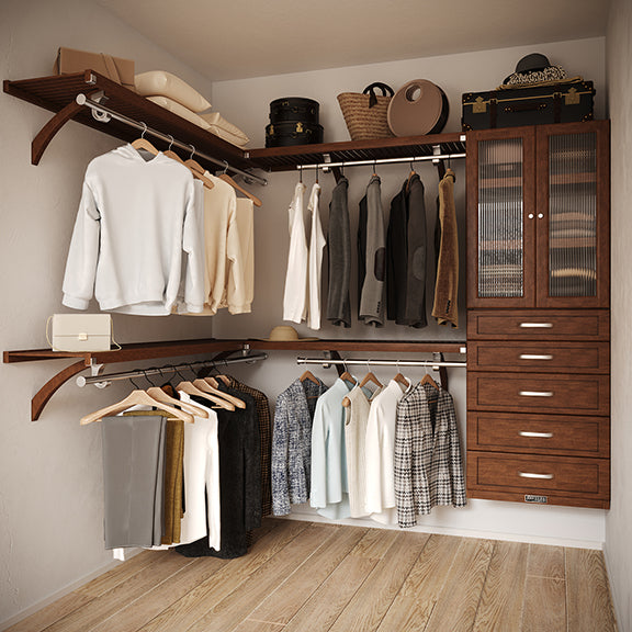 Chestnut L Shaped walk in closet organizer with 5 drawers and doors,  clothes and hanging in a primary bedroom closet.