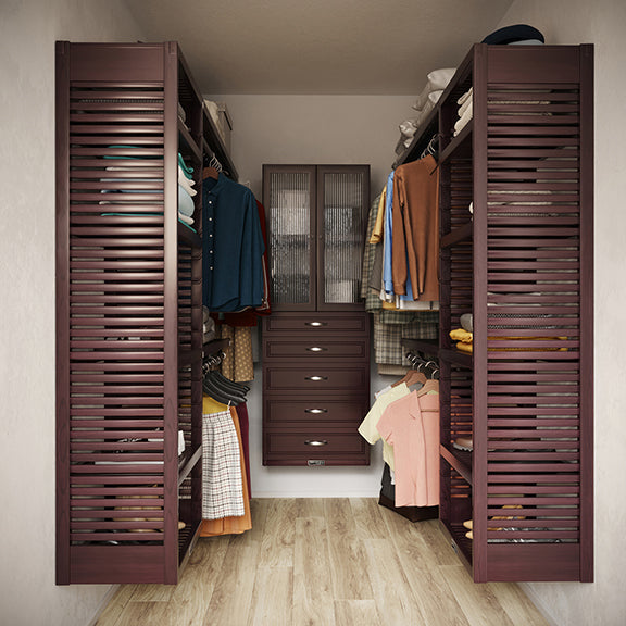 Espresso U shaped walk-in closet with shelves, drawers ,doors and clothes on hangers