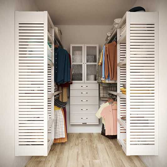 White U shaped walk-in closet with shelves, drawers ,doors and clothes on hangers