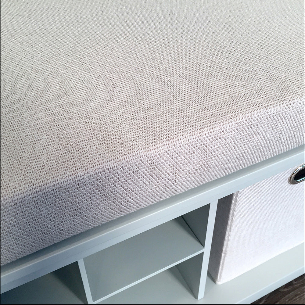 closeup of cream tweed cushion on grey entryway bench