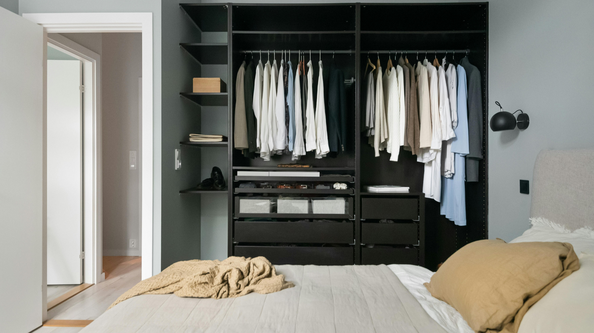 Closet organizer installation in bedroom storage space