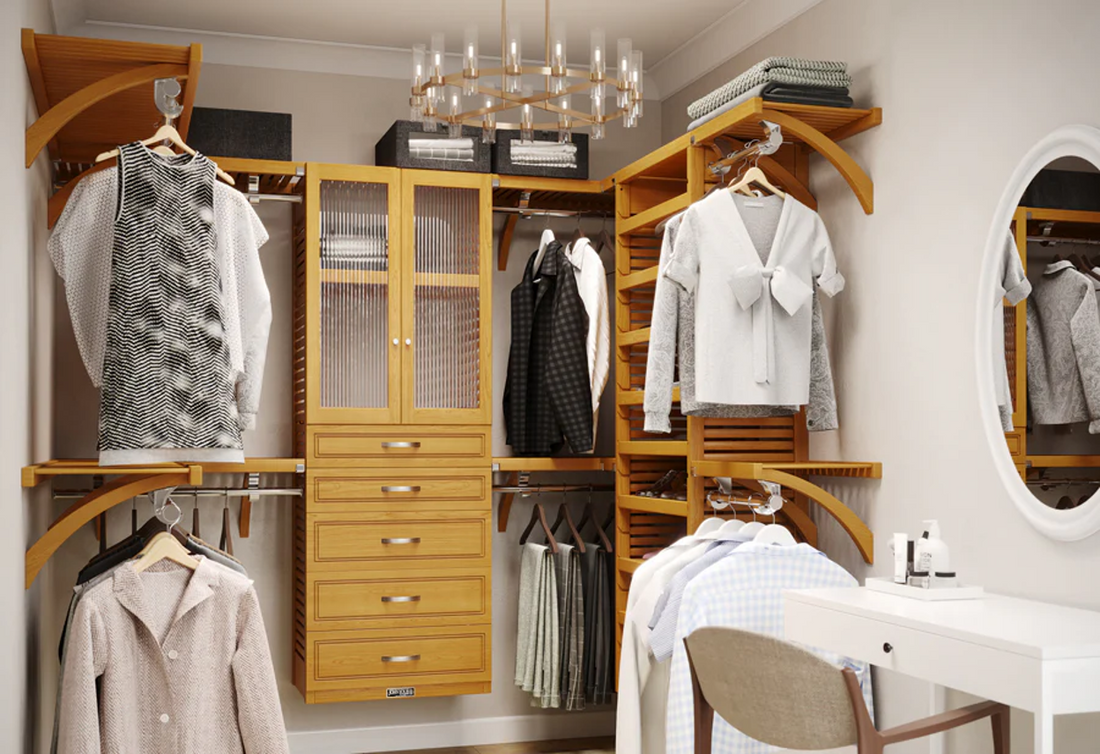 Walk in closet with organizer clothes and a dressing area