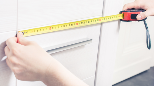 Measuring closet width with a tape measure