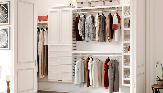 Modern walk-in closet with white wardrobe and hanging clothes