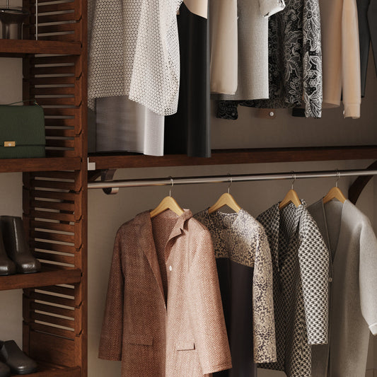 Closet with hanging clothes and wooden shelves