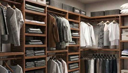 Closet with wooden shelves and hanging clothes