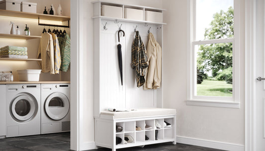 Entryway with coat rack, bench, and laundry area.