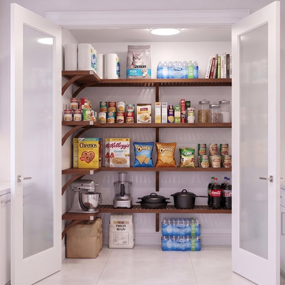 An organized L shaped walk-in pantry with 4 levels of chestnut solid wood shelving and frosted glass doors stocked with grocery items.