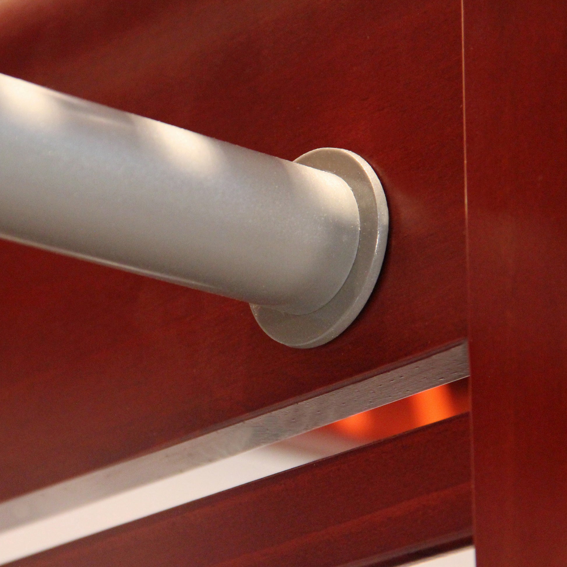 closeup of garment bar on closet organizer