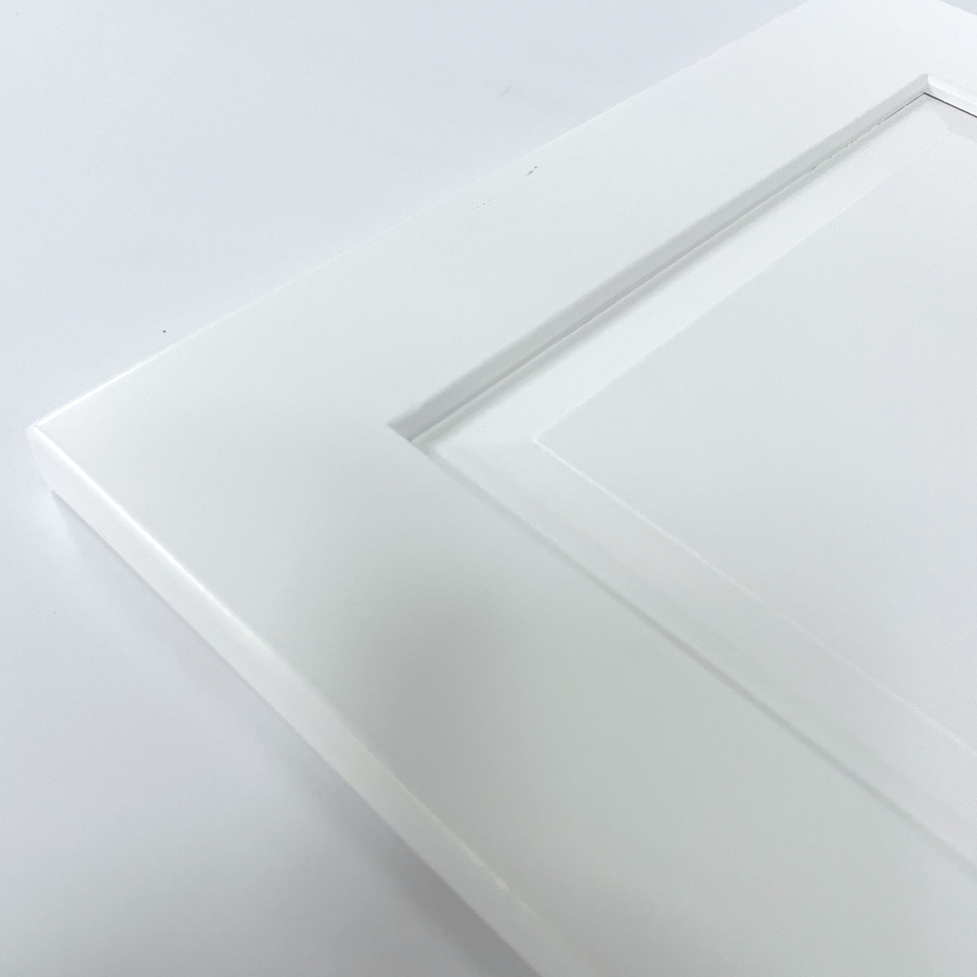 close up detail of white raised panel in tower doors