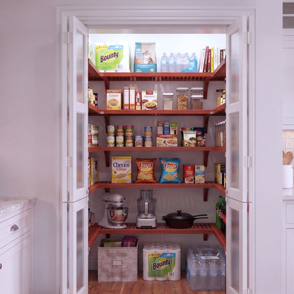 An small U shaped walk-in pantry with 5 levels of red mahogany solid wood shelving filled with grocery items.