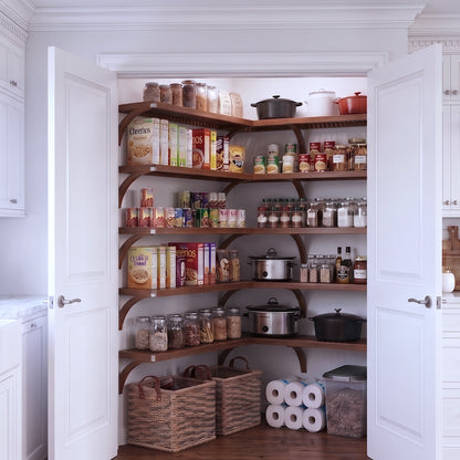 A fully stocked L shaped walk-in pantry with 5 tiers of chestnut solid wood shelves filled with kitchen appliances and  grocery foods.