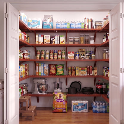 A well-organized standard walk-in pantry with 5 red mahogany finished solid wood shelves stocked with various grocery items.