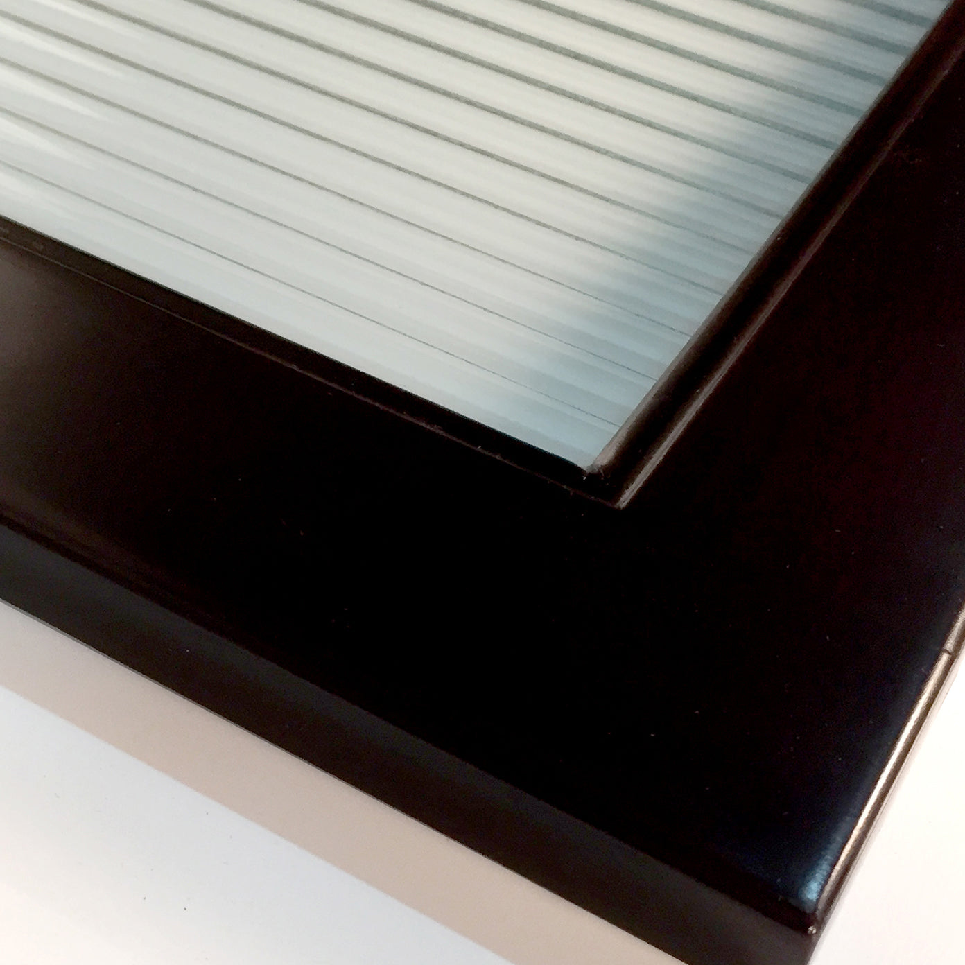 closeup of glass door corner espresso
