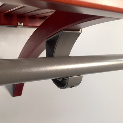 close up of garment bar with j -hook attached to wooden shelf