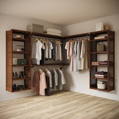 Chestnut L Shaped walk in closet organizer with clothes and shoes in a room.