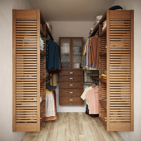 Chestnut U shaped walk-in closet with shelves, drawers ,doors and clothes on hangers