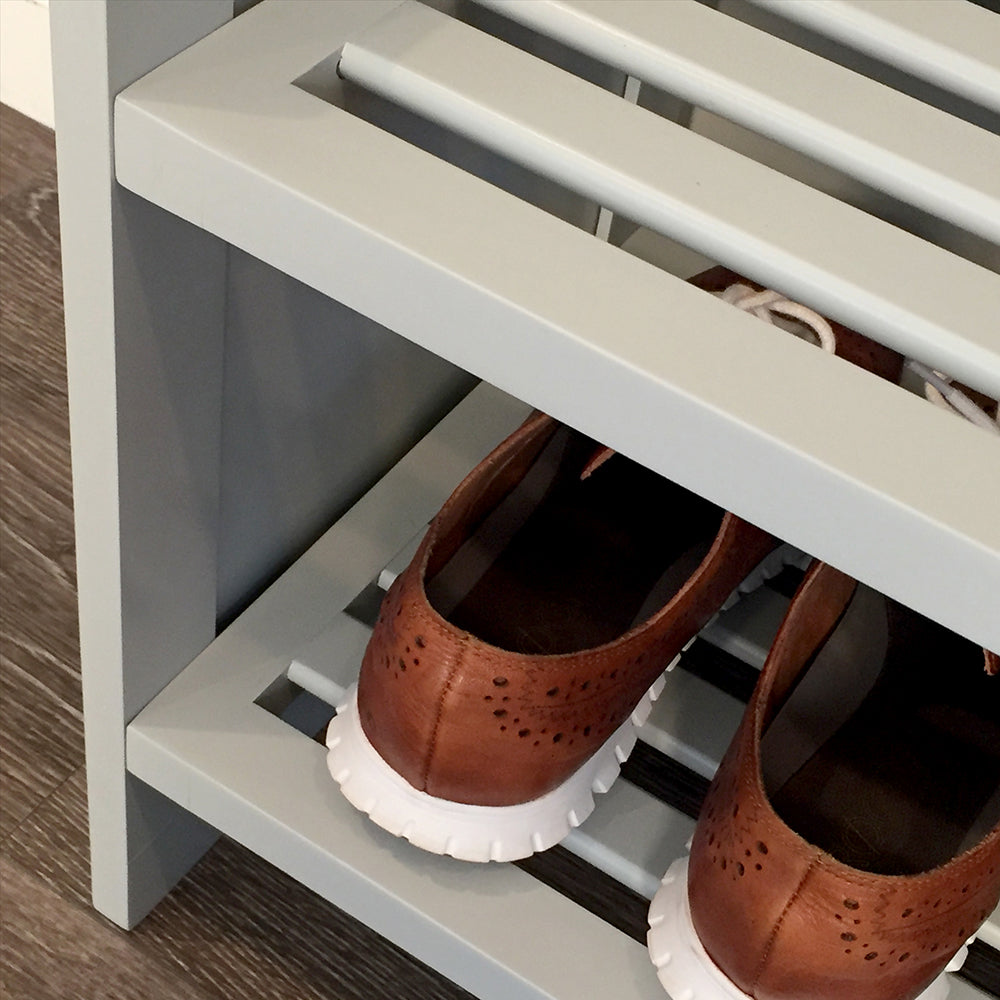 close up detail of the sides and shelves of a grey shoe storage rack
