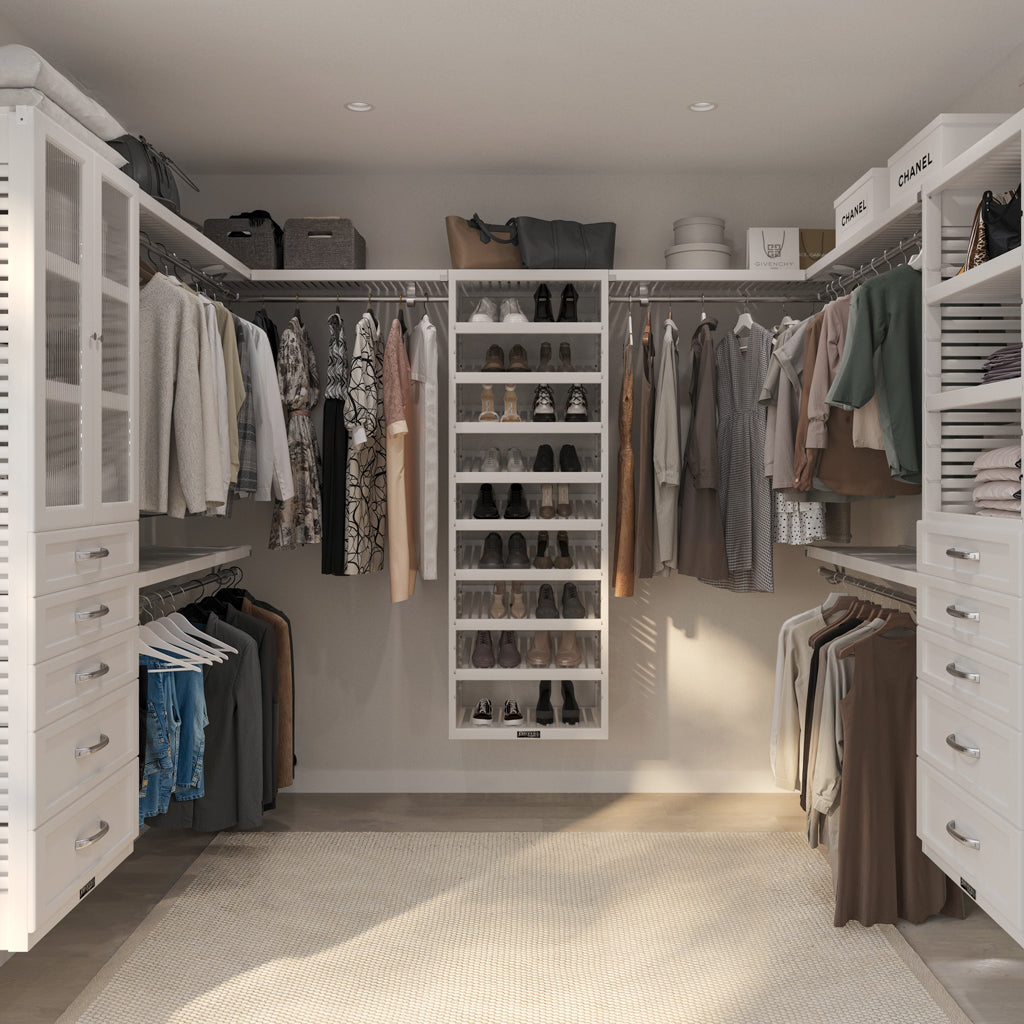 after view of walk-in closet with organized clothing, shoes, and bags